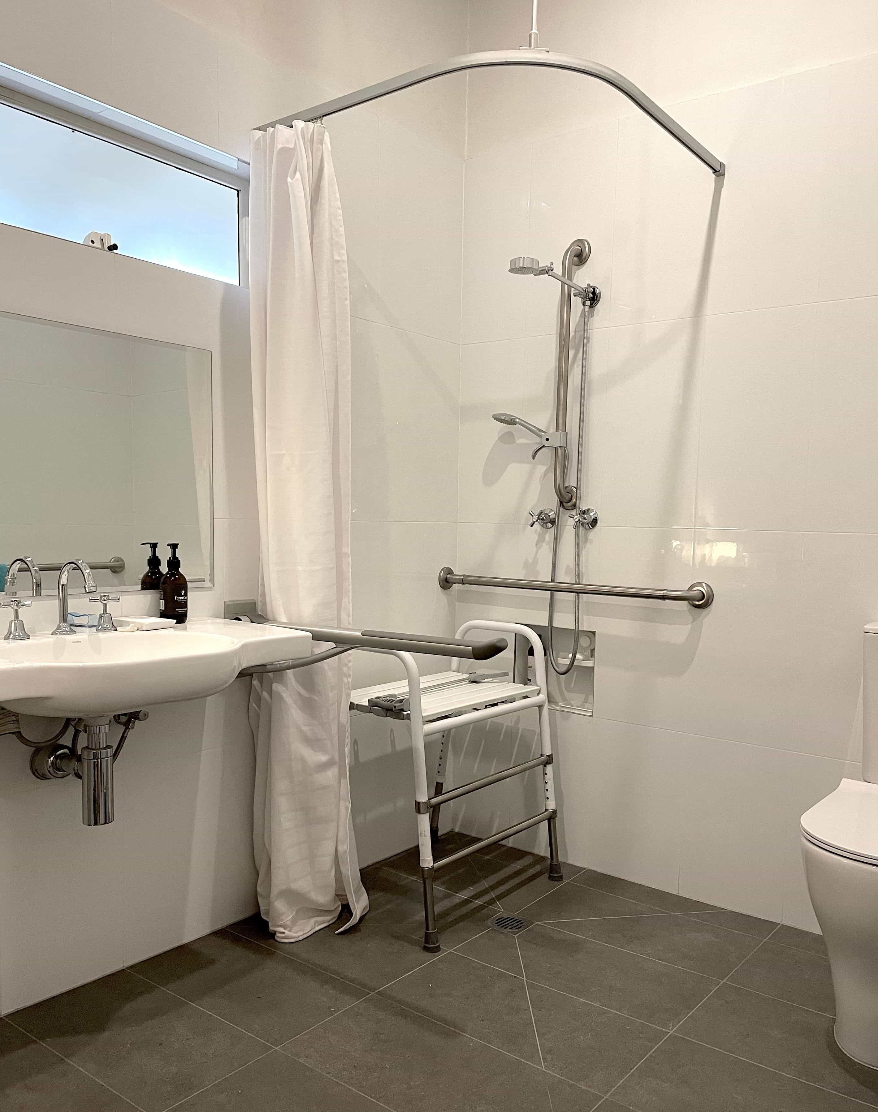 NDIS accessible bathroom plumbing modification in Melbourne home