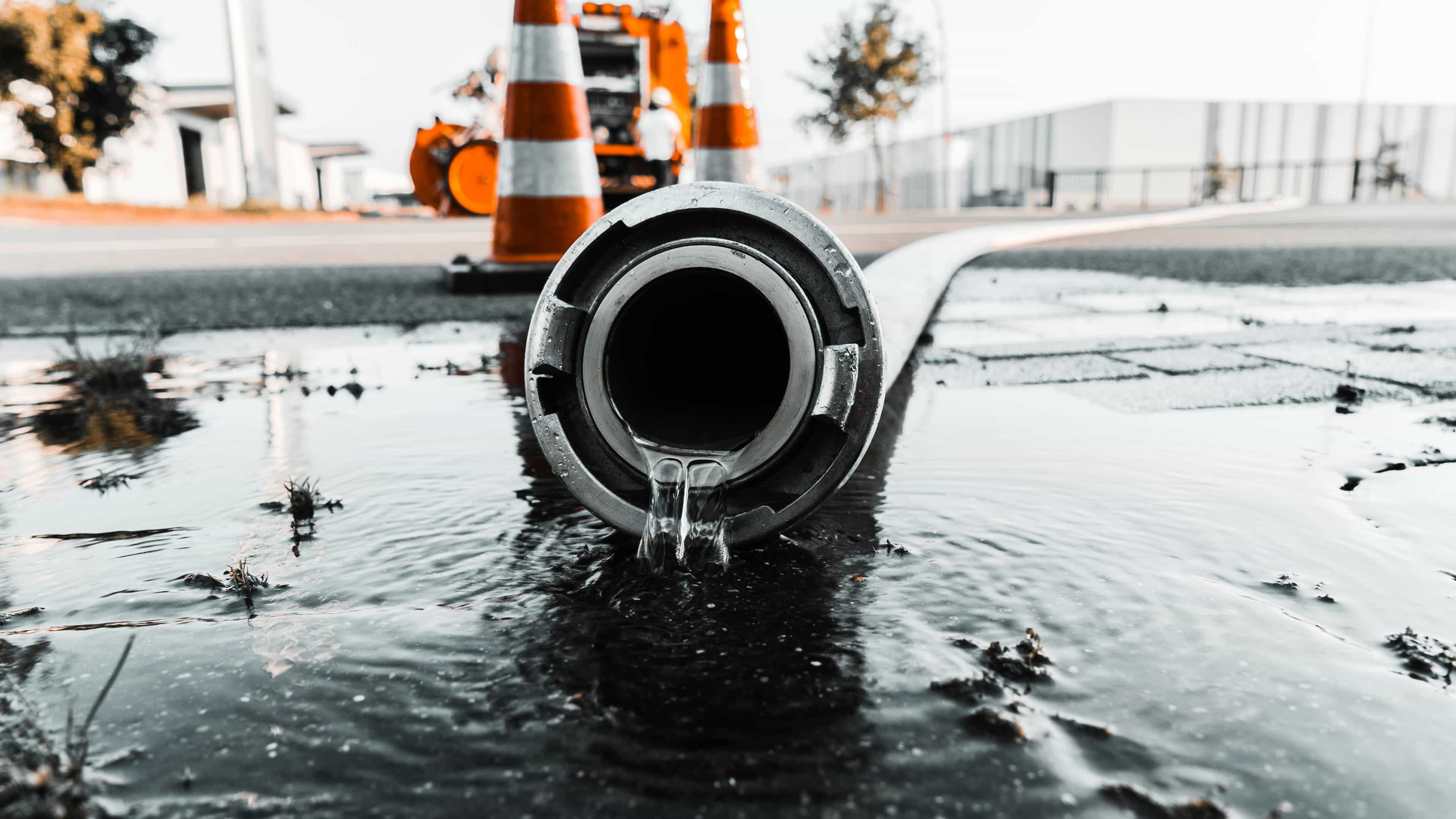Emergency plumber repairing burst pipe in Melbourne commercial building